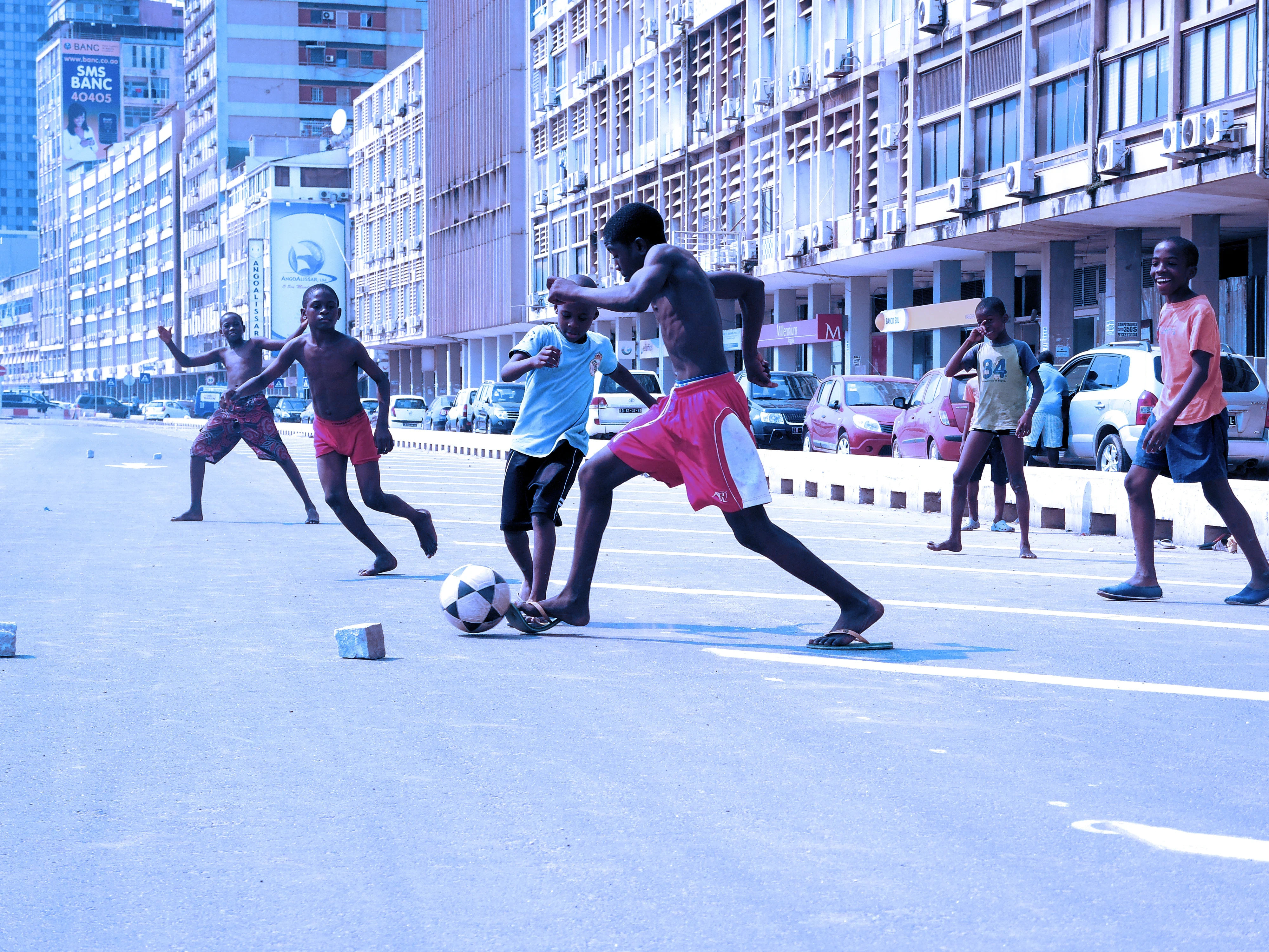 Kids playing football on a Luanda street
