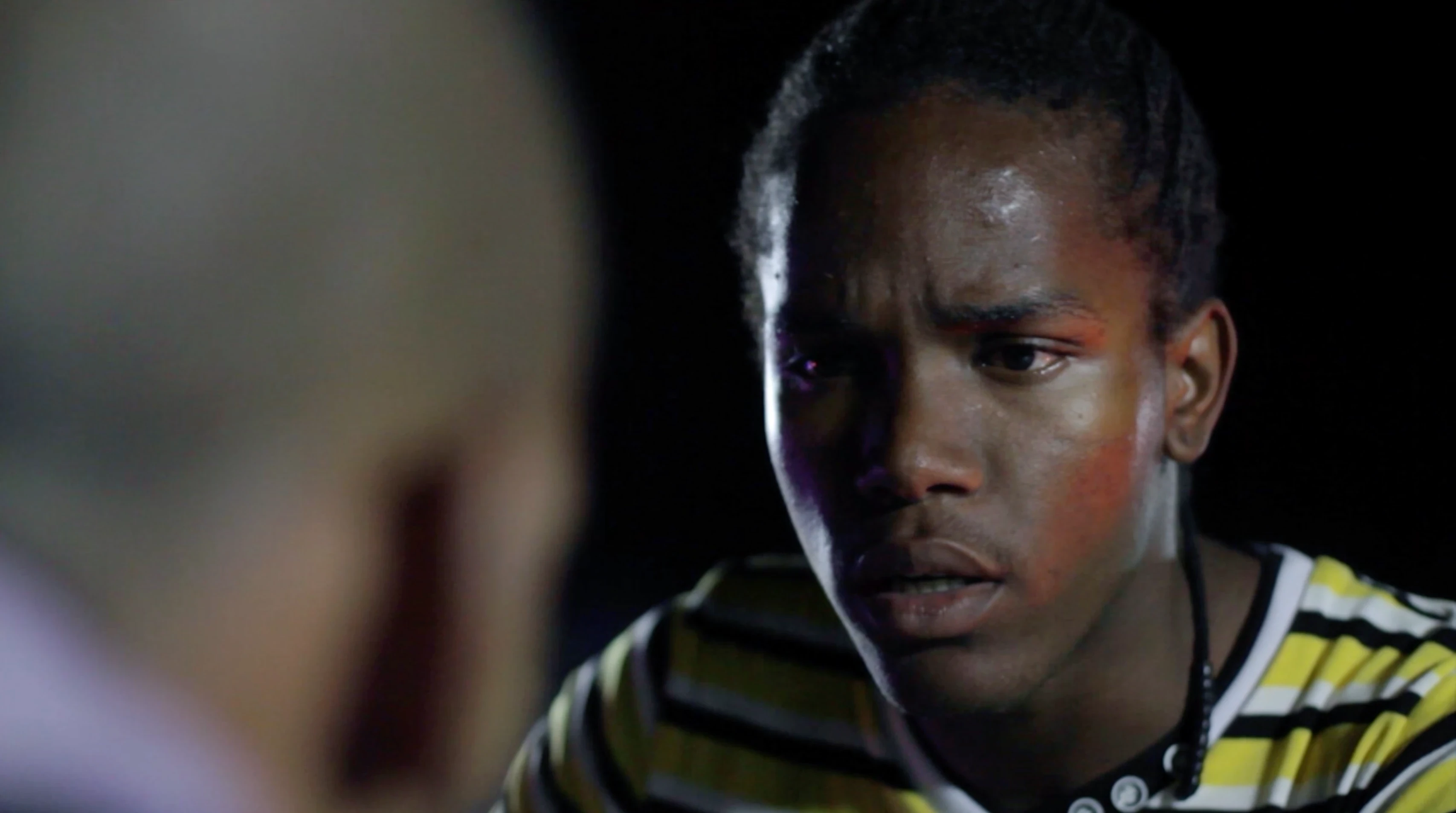 TV spot still: two characters in conversation